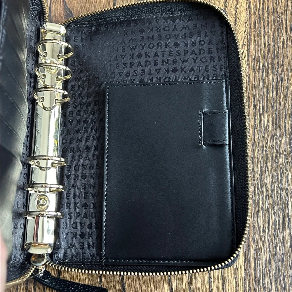 Black leather Kate Spade Wellesley zip around personal organizer/planner